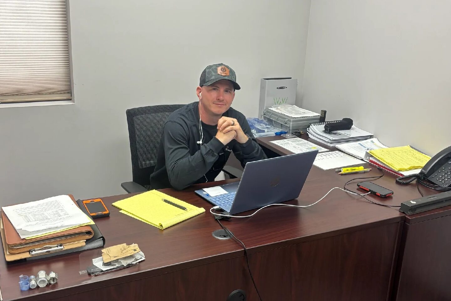 Man working at office desk with laptop